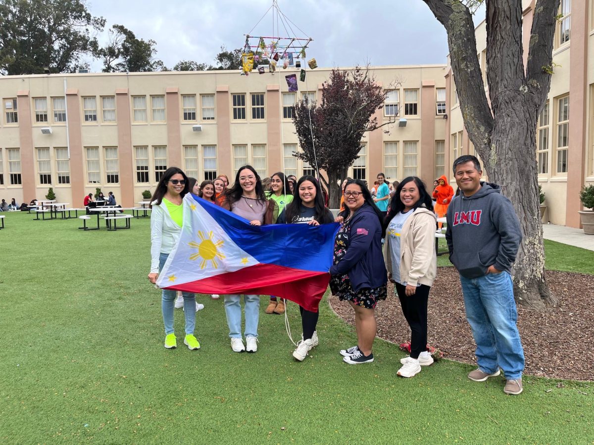 Filipino staffulty and students share their culture in the Father Downey Garden. 