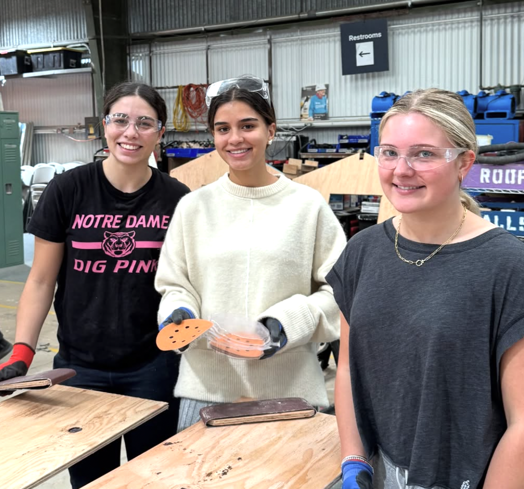 NDB tigers participating in Habitat for Humanity, preparing playhouses for children, to get service hours.