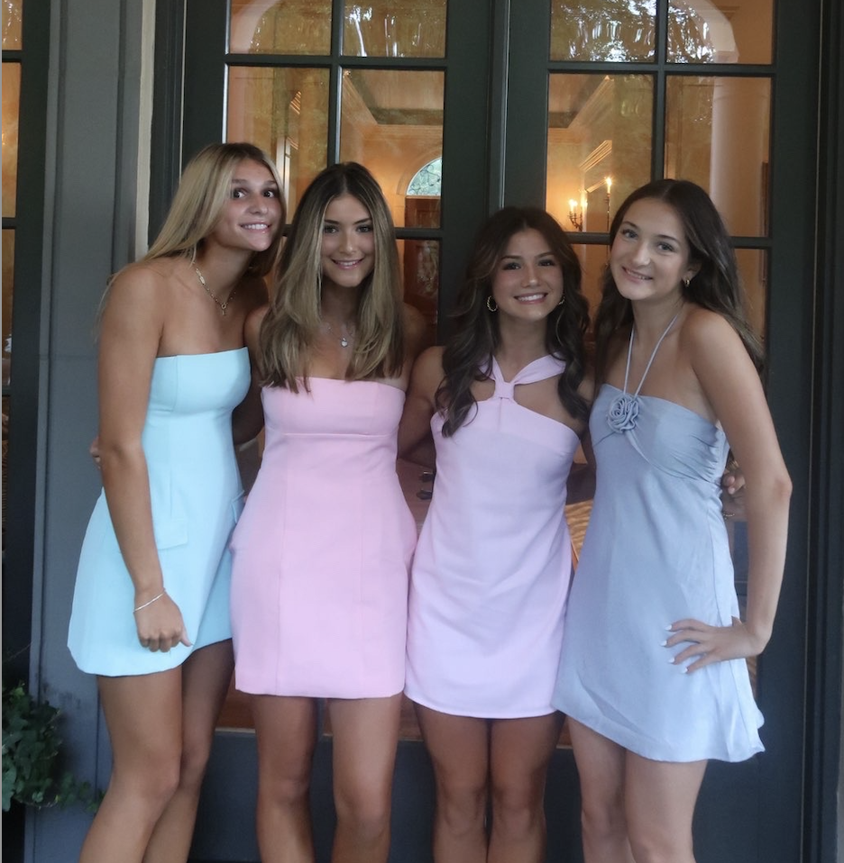 Juniors Ella McKinney, Caitlyn McCabe, Olivia Philip, and Ava Barbagelata posing for a photo on the night of Hoco.