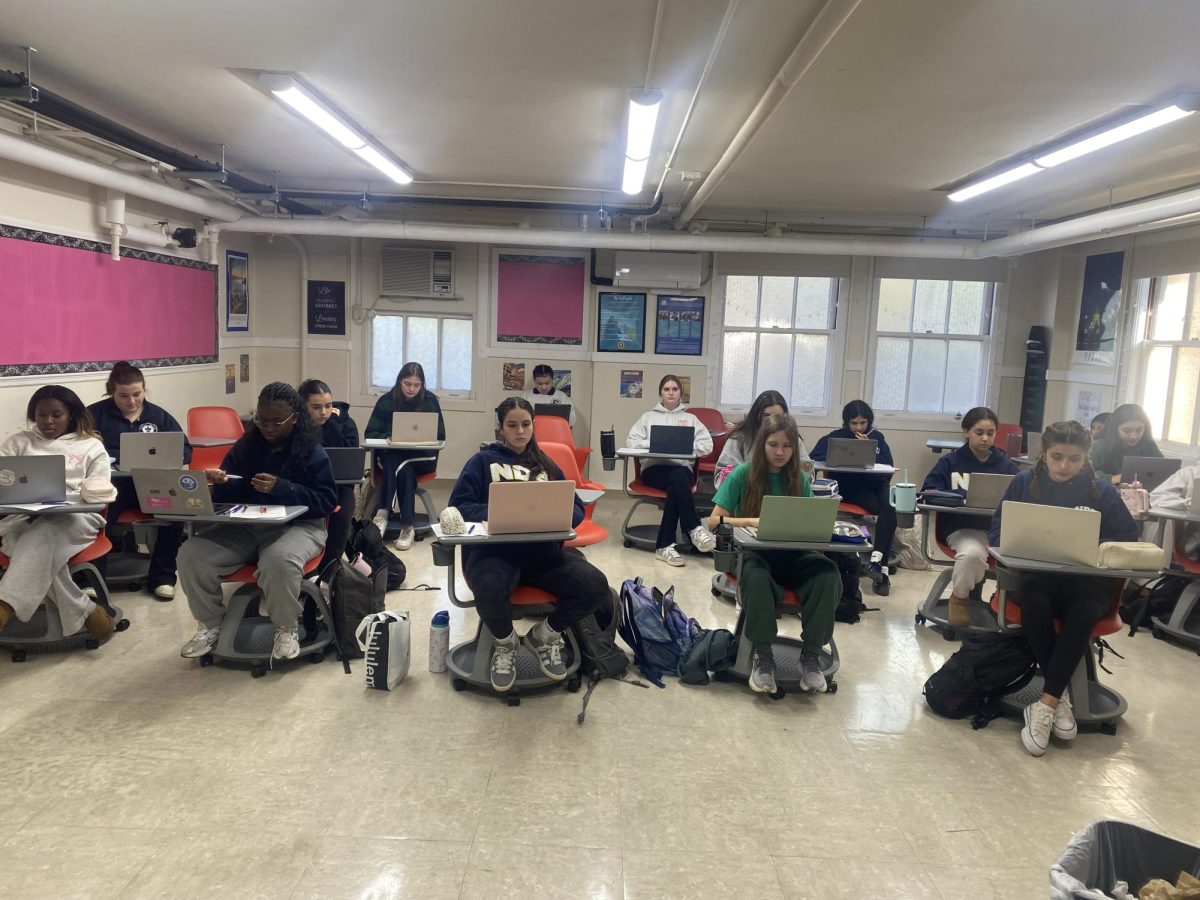 NDB students working on their laptops.