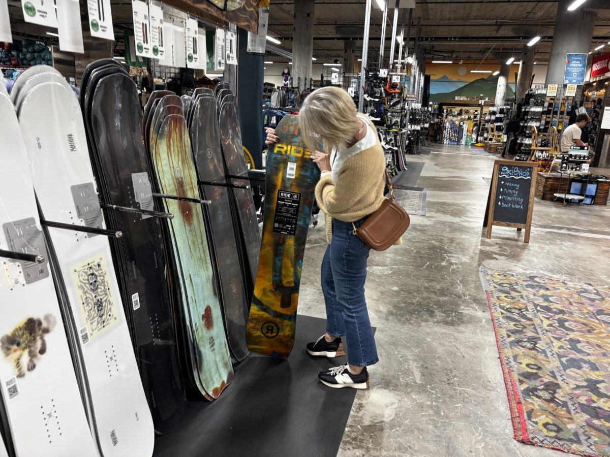 The Sports basement ski/snowboard section is preparing customers for ski season. 