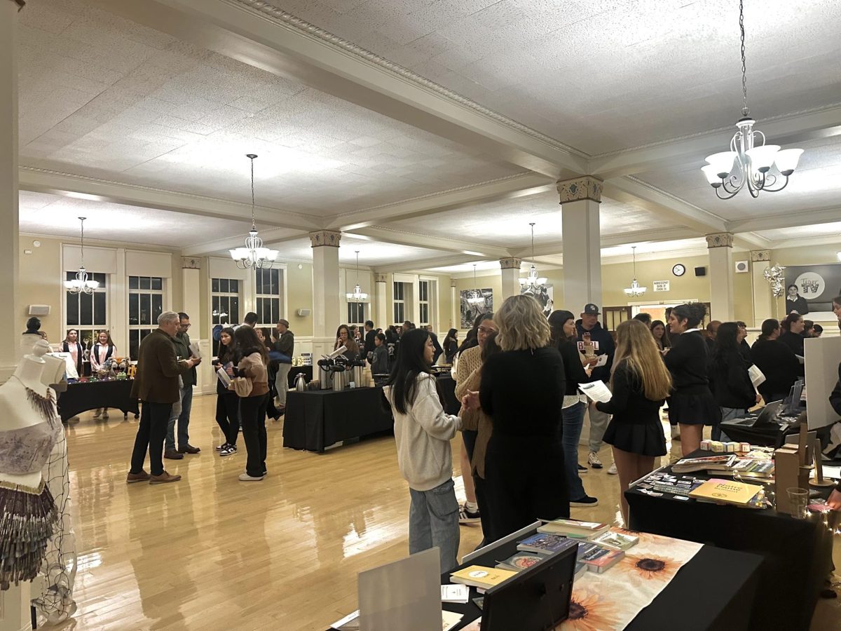 Prospective families gather in the Dining Room to visit department tables and learn more about the opportunities offered at NDB.