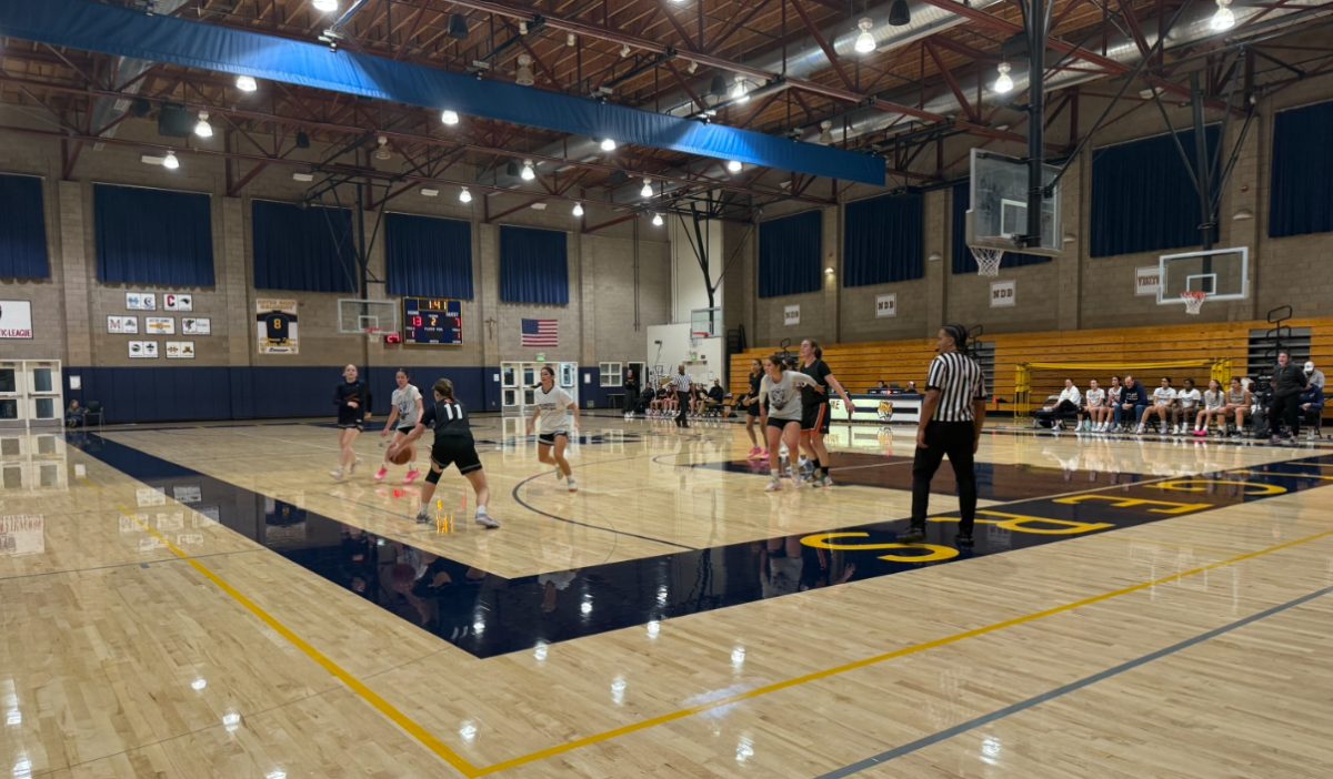 NDB's varsity basketball team taking the lead in a scrimmage against Half Moon Bay High School.