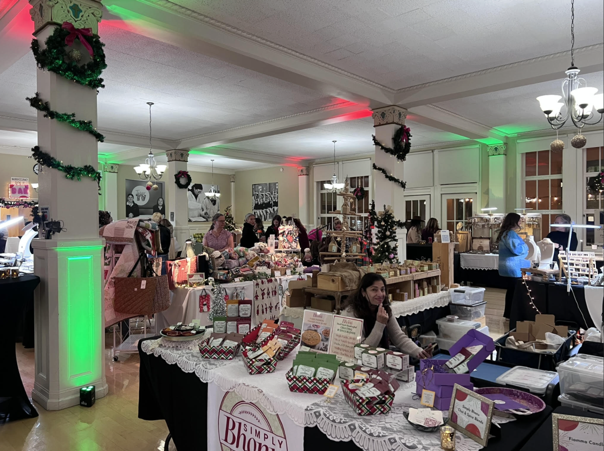 Local vendors set up and organize their booths in the dining room.