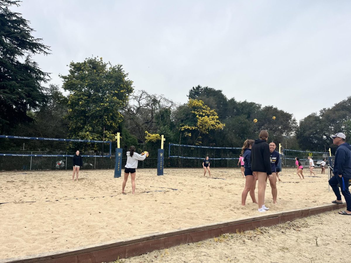 Beach volleyball athletes participating in court times at NDB's sand courts to prepare for tryouts.