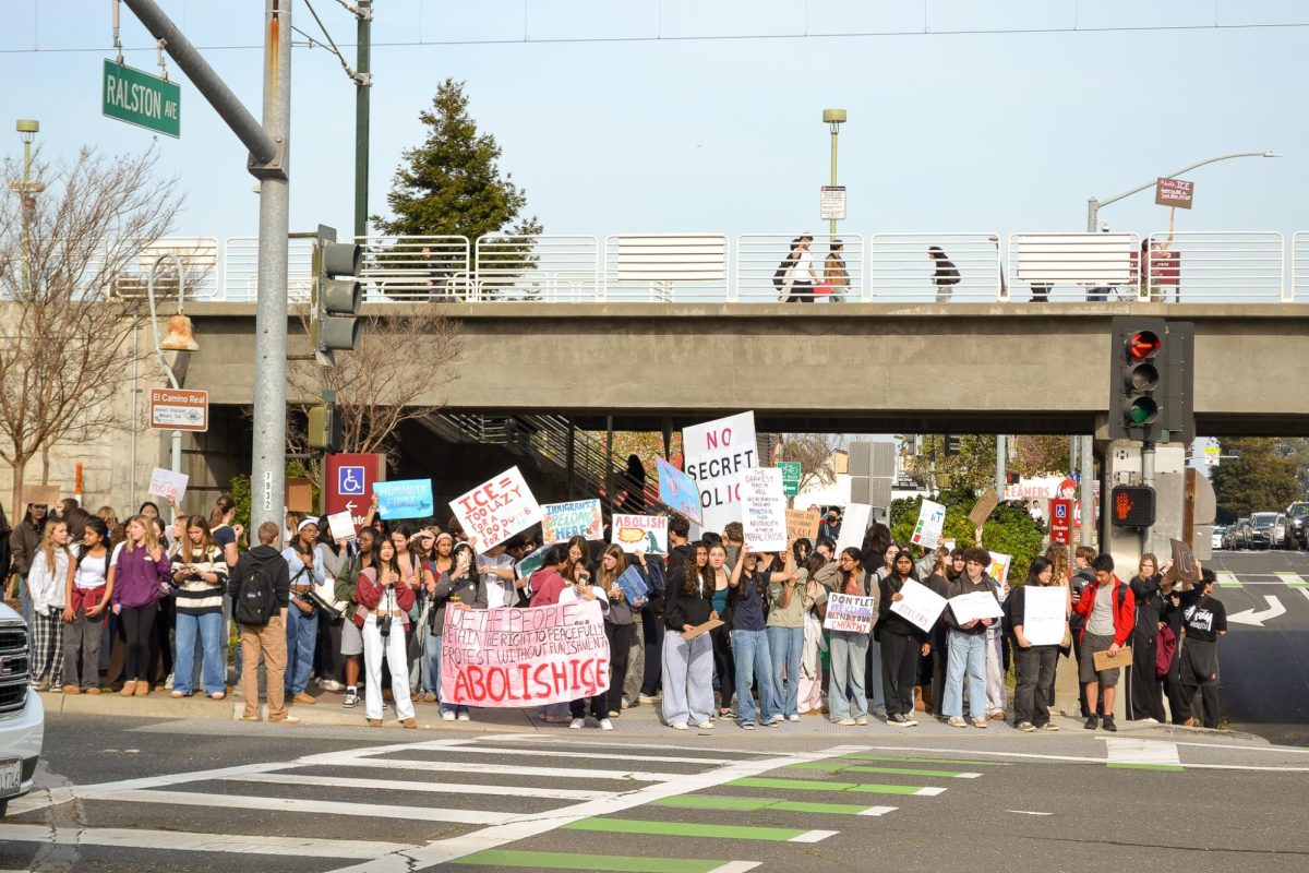 Teen voices rise in protest near the Belmont Caltrain station where local students gathered together.  