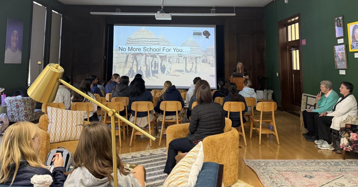 Students and community members listen to guest speaker Lizzie Dalton discuss Mercy Beyond Borders.