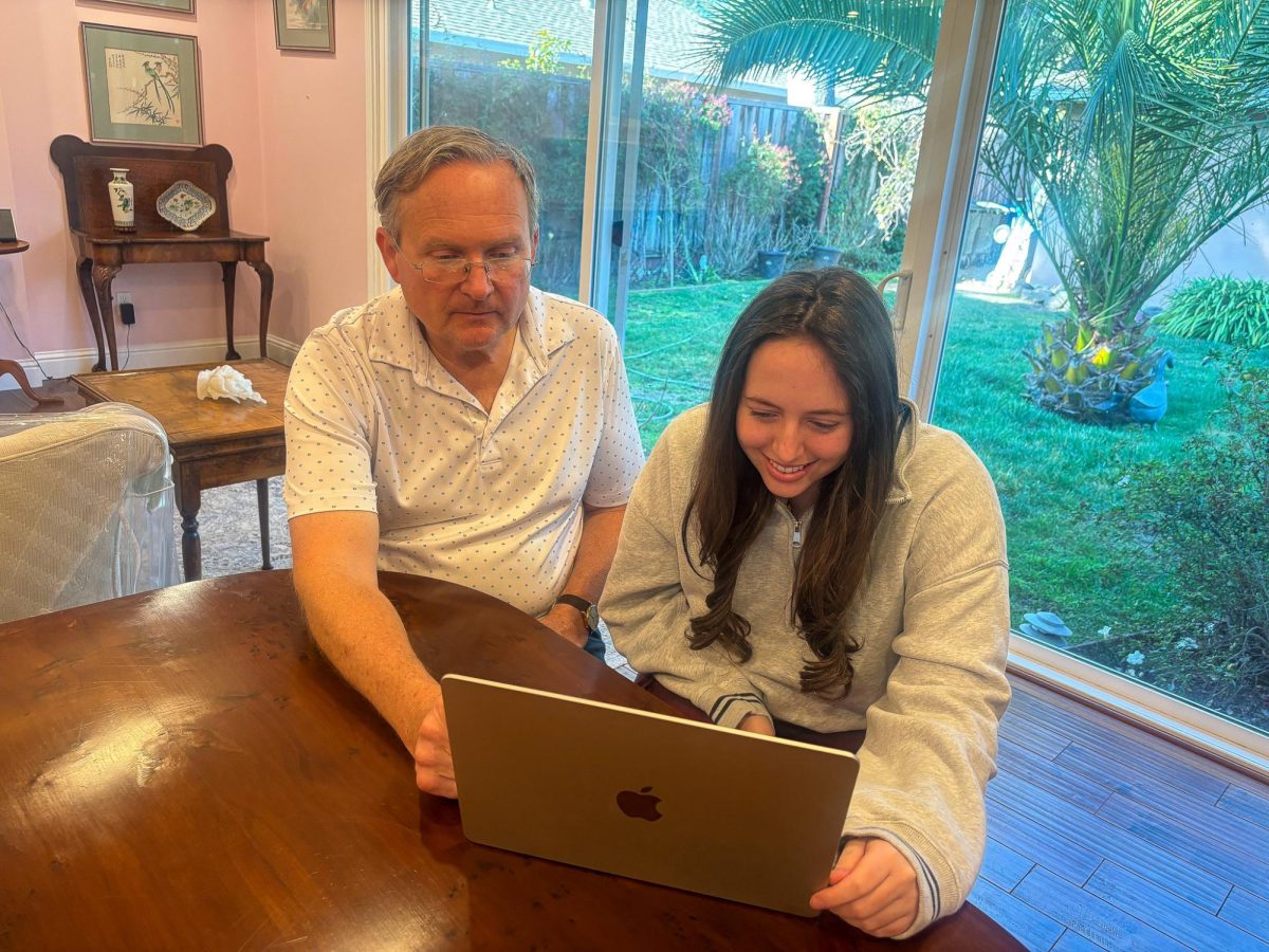 A NDB student and her parent review the new course catalogue for the upcoming academic school year.