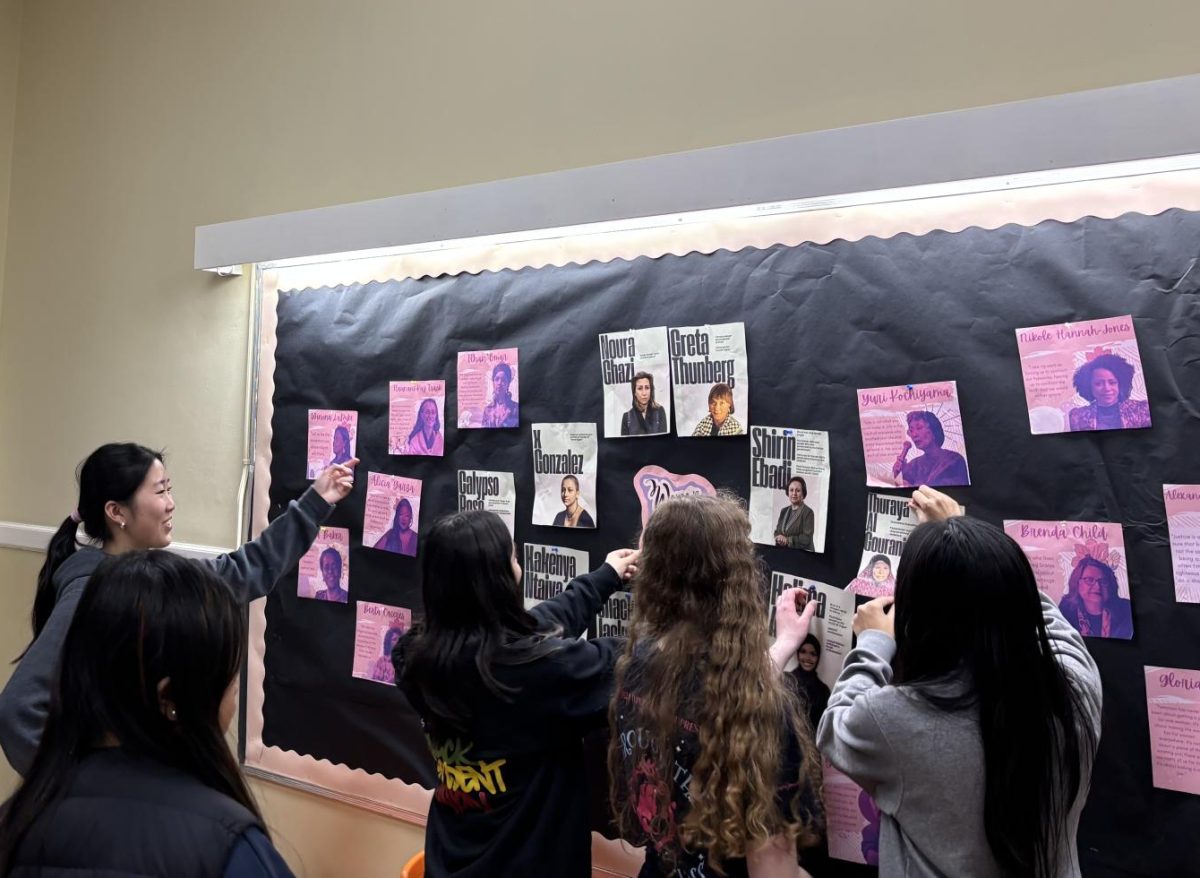 Intersectional Feminism Club prepares a Women’s History display.