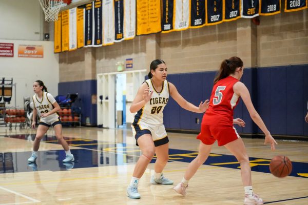 Junior Sammy Kakala plays defense against an opponent.