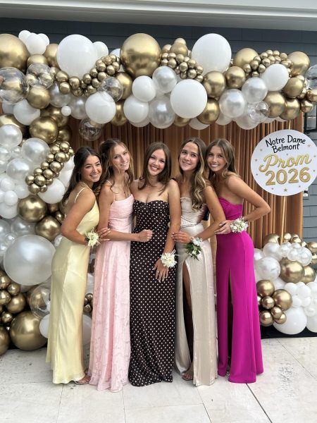 Tali Cuneo, Maise Street, Finley WilkeHiland, Olivia McGlynn and Juliana Loar posing for a photo before heading to prom.