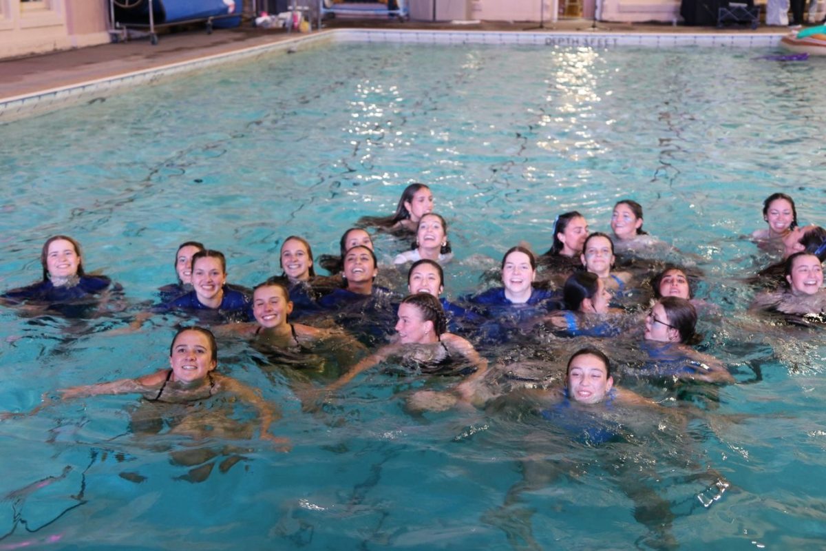 Seniors sharks jump in the pool after securing Aqucades victory.