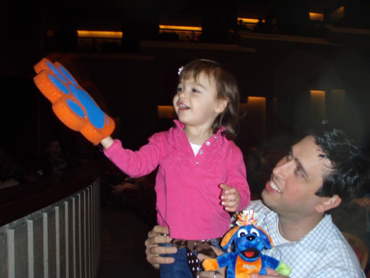 Alexandra and her father attend a preschool concert, "Raggs."