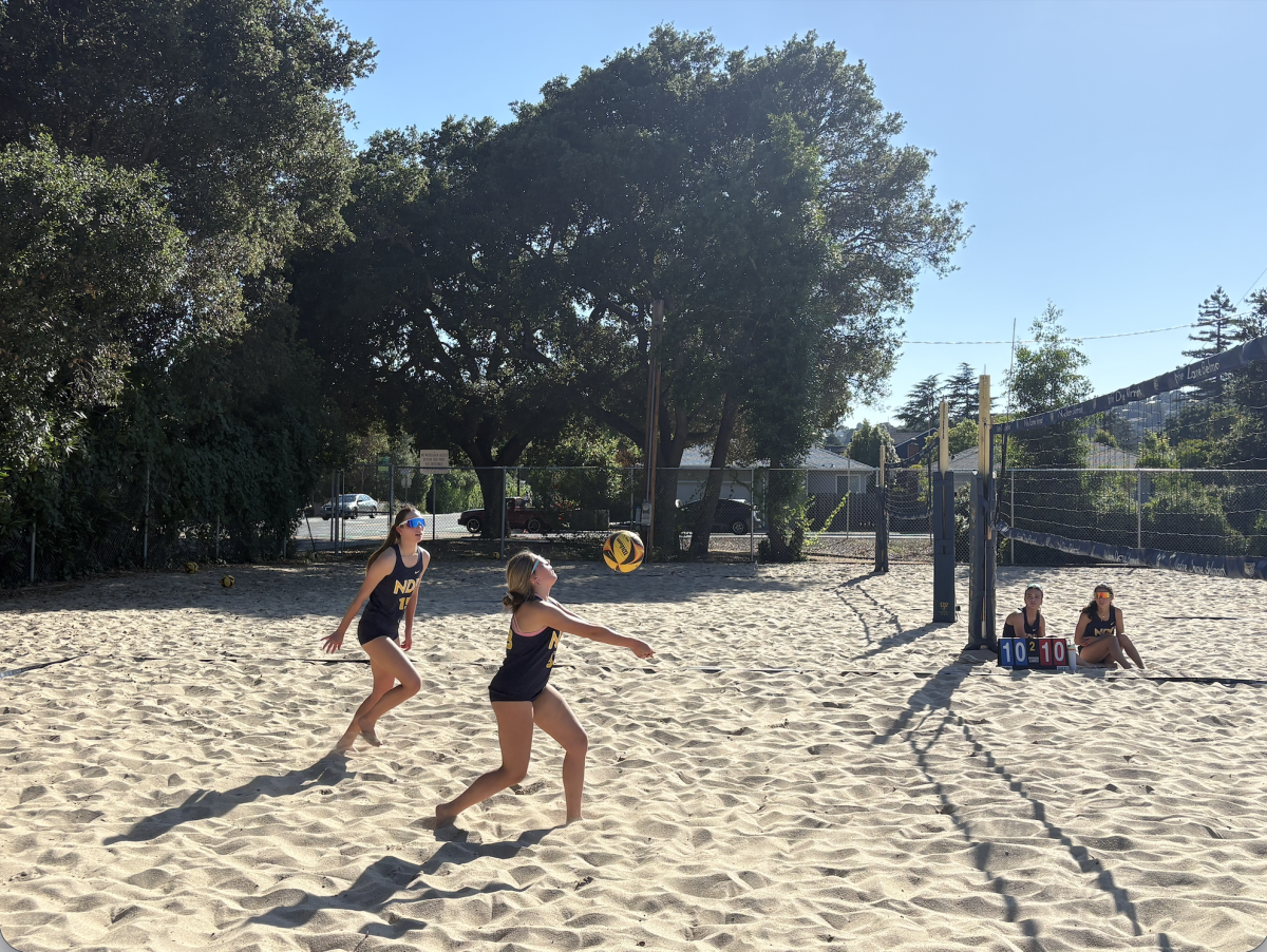 Freshmen Sevasti Christoforidis and Nicolette Navarrete set up an attack.