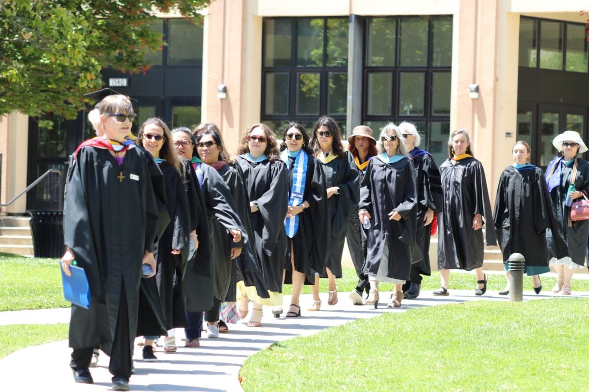 Faculty members lined up for a procession to honor the graduates.